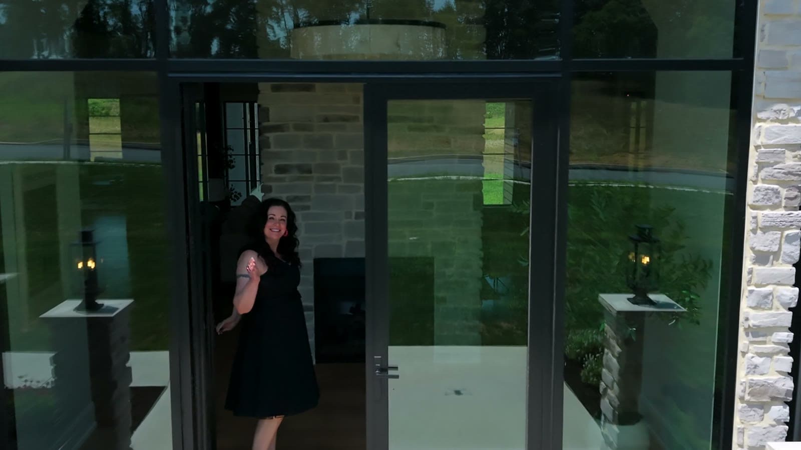 Shannon Clayton holding the front door open