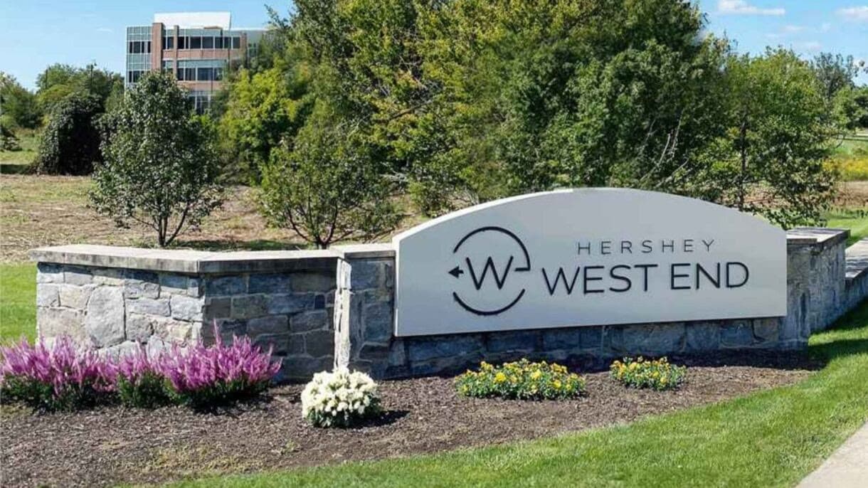 The Hershey West End entrance sign, a stone wall with a lettered panel, on Waltonville Road